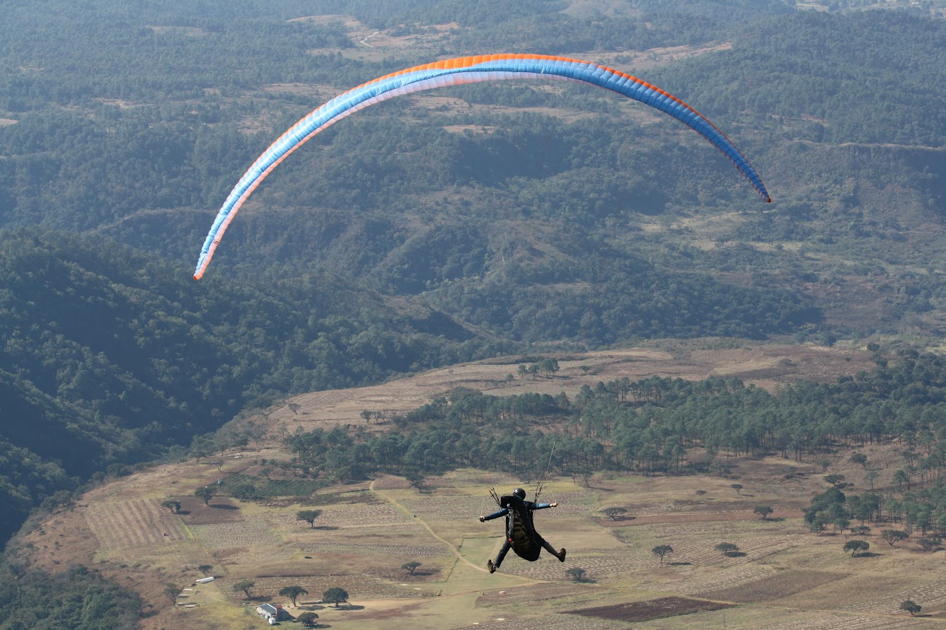 Paraglider on approach to landing